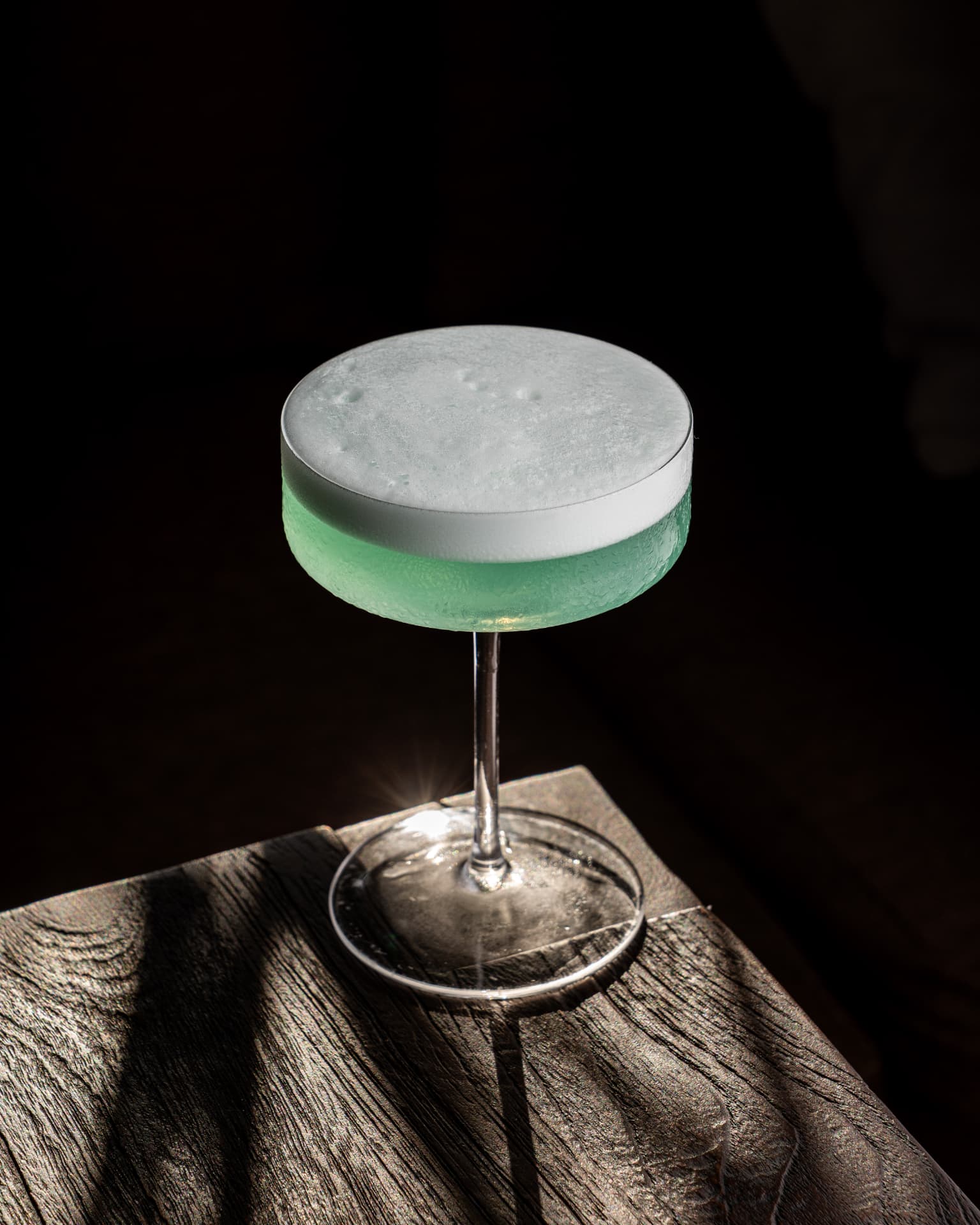 Pale green cocktail with a soft foam top at TAMAN